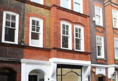 Exterior view of the red brick and white-fronted building at 5 Margaret Street.