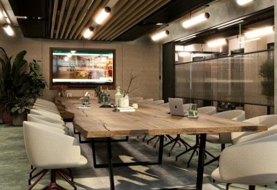 Professional boardroom with a large live-edge wooden table and plush cream chairs.