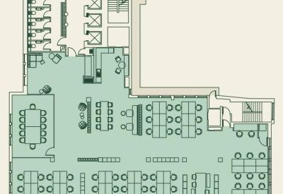 Floor plan of an office level with workstations and meeting areas.
