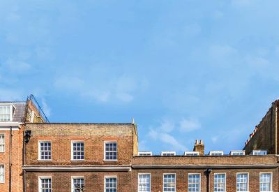 Exterior view of the classic brick townhouse facade at 8-10 Hill Street.