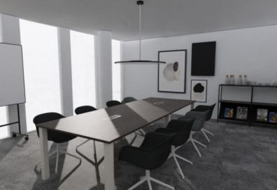 Modern conference room with a long dark wood table and minimalist black chairs.