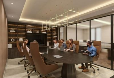 Professional meeting room with an oval table, leather chairs, and a geometric chandelier.