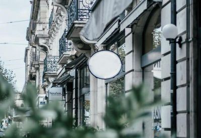 Classic stone facade and ornate balconies of the office building at Boulevard James Fazy 6-8.