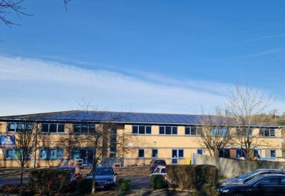 Exterior view of the tan brick building at Caerphilly Business Park, Van Road.