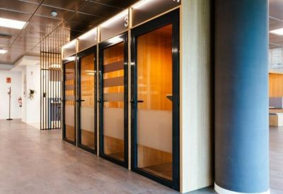 Row of private soundproof phone booths for quiet calls and focused work.