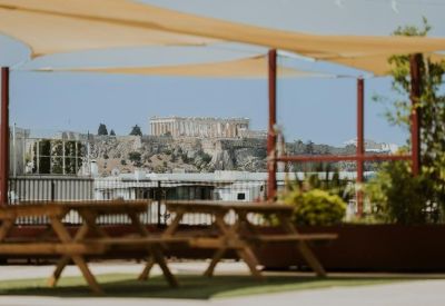 View from the rooftop terrace overlooking the historic Parthenon in Athens.