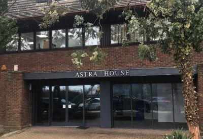 Close-up exterior view of the brick facade and main entrance of Astra House.