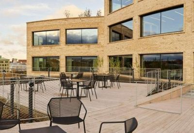 Spacious rooftop terrace with modern patio furniture and city views.