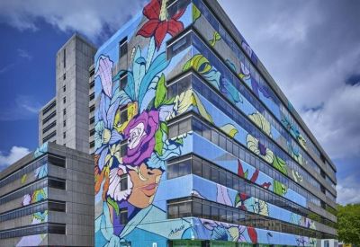 Exterior view of the mural-covered Frobisher House, Nelson Gate.