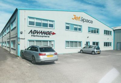 Exterior view of the white and blue facade of Hangar 4, Cecil Pashley Way, Shoreham-By-Sea.