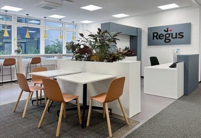 Modern reception lobby with integrated planters and seating.