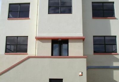 Exterior view of the Legacy Centre, Hanworth Trading Estate showing the multi-story cream building facade.