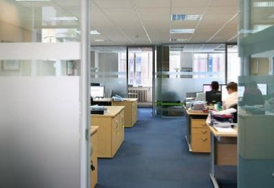 Reception area and office entrance with frosted glass branding.