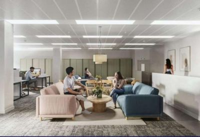 Reception area featuring a minimalist front desk and a comfortable lounge seating group.