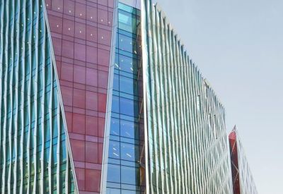 Exterior view of the colorful geometric glass facade of Nova North.