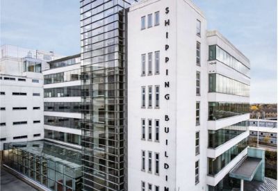 Exterior view of the white facade and glass tower at Alpha House, 100 Borough High Street.
