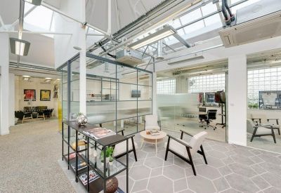 Open seating area with glass partitions and modern furniture