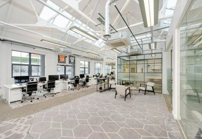 Spacious office with skylight and open workstations