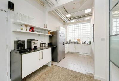 Kitchen with modern appliances and white cabinetry