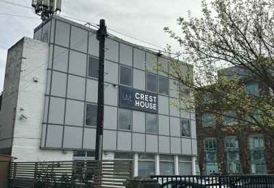 Exterior facade showing the building signage and large windows.