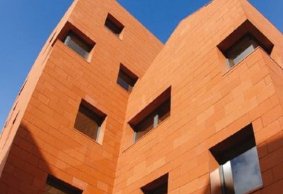 Exterior view of the modern red brick building at 12 place Saint Hubert, Lille, Nord.