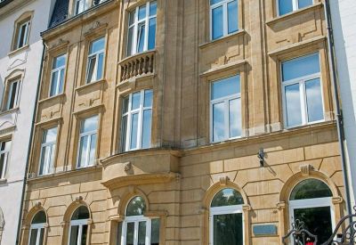 Ornate sandstone facade of the traditional building at 124 Boulevard de la Petrusse.