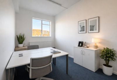 Meeting room with eight chairs and a large screen.