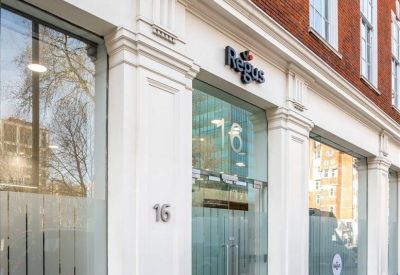 Exterior view of the classic red brick facade and white entrance at 16 Upper Woburn Place.