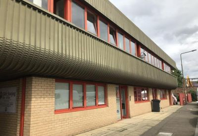 Exterior view of the industrial-style brick and metal building at 17b, Graham Street.