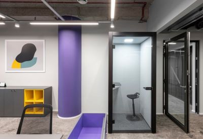 Reception area with a yellow and purple color scheme.