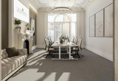 Sleek meeting area featuring a central workstation and decorative fireplace.