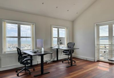 Bright workspace at 36, Marselisborg Havnevej with two desks and views of the harbor.