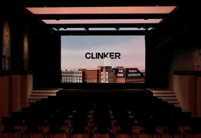 Clinker logo displayed in a dark auditorium setting.