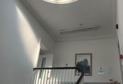 Lobby at 40 Rodney Street with a grand circular skylight and ornate period plasterwork.