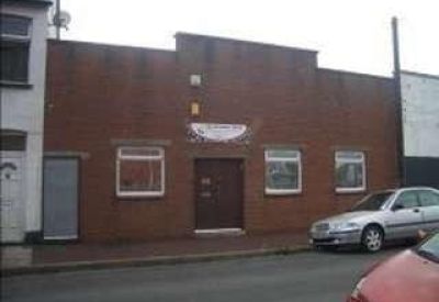 Exterior view of the red brick building at 44 Argyle Street, Newport, Wales.
