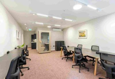 Open-plan office area with spacious desks and natural light.
