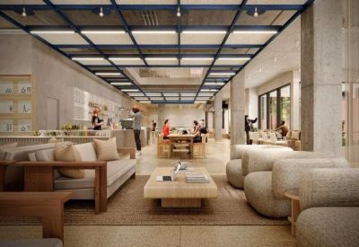 Expansive communal lounge featuring a cafe area and contemporary seating under a grid ceiling.