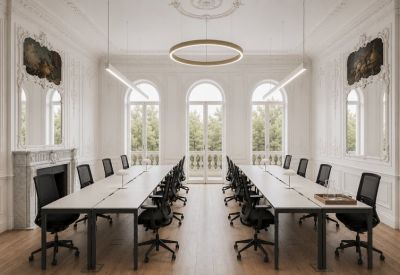 Grand meeting room featuring ornate wall mouldings, arched windows, and a circular halo light pendant.