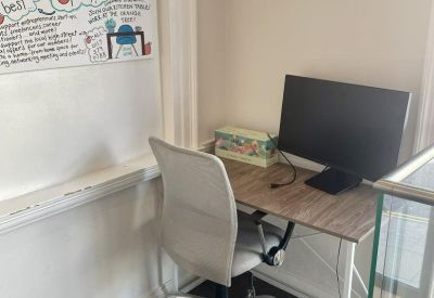 Private workstation with an ergonomic chair and a white board for brainstorming.