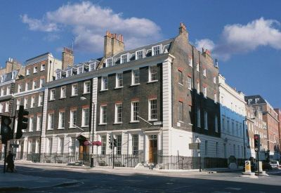 Exterior view of the historic brick facade at 53 Davies Street, Mayfair.
