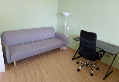 Simple lounge area with sofa and desk