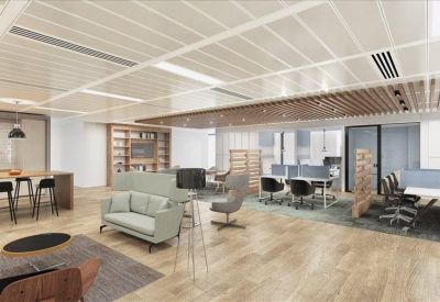 Spacious communal breakout area with a light green sofa, wooden flooring, and collaborative zones.