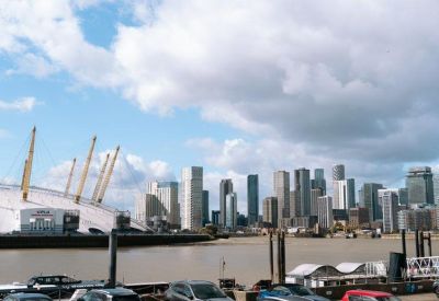 Wide view of the London skyline and the O2 Arena from across the river.