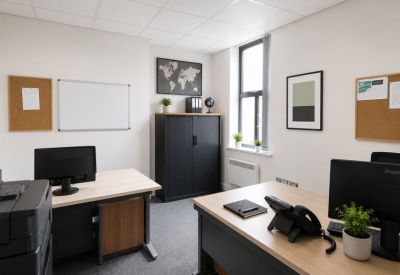 Two-person office suite with light wood desks, plants, and a world map.