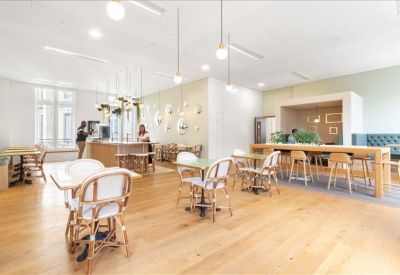 Private yellow work booths with built-in tables and comfortable cushioned seating.