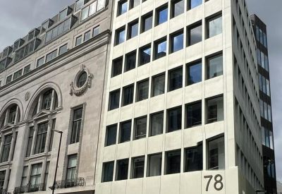 Exterior of the modern white and stone facade at 78, New Oxford Street.