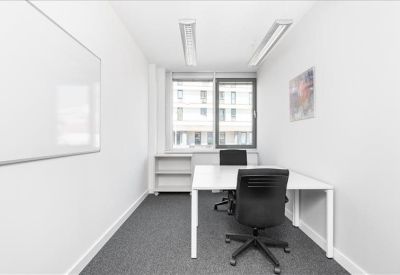 Private two-person office suite with white desks and a whiteboard.