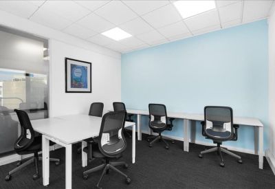 Meeting room at Broad Quay House, Prince Street, with long white desks and ergonomic chairs.