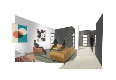 Bright breakout area with tan leather sofas and modern wall art.