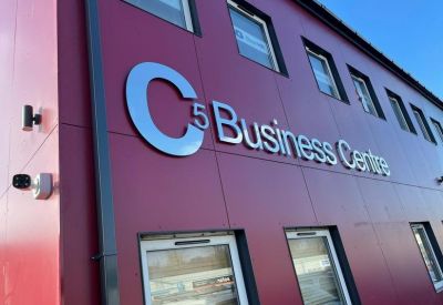 Exterior building signage displaying the business center name.